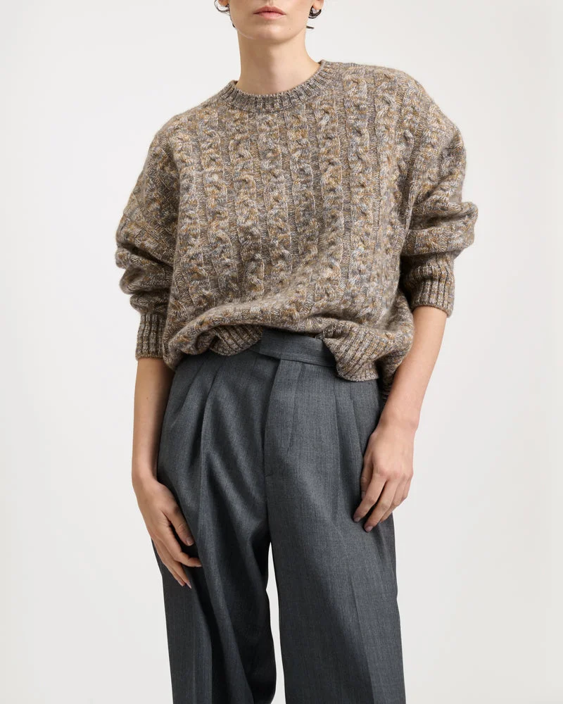 Santosh Clothing model wearing a textured knit sweater and grey trousers