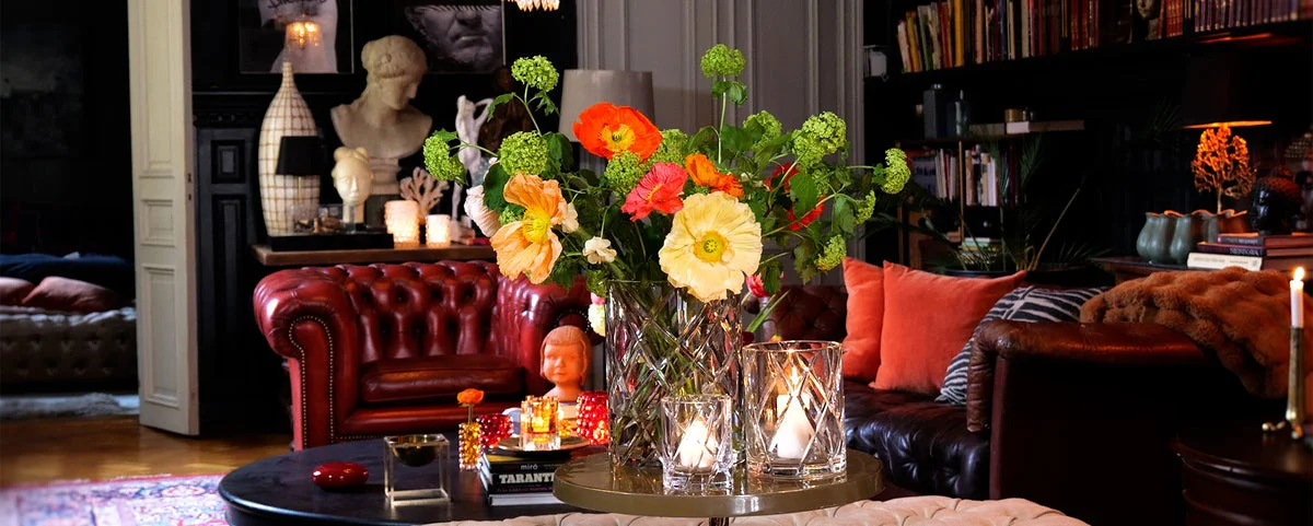 Skogsberg & Smart crystal glassware with flowers in a colourful living room