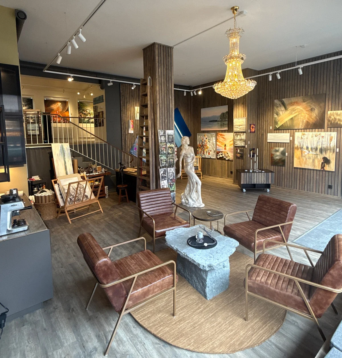 Paintings and seating inside Sofias Galleri